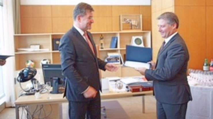 Lajčák presented Korneliou a certificate of achievement in recognition of his contribution